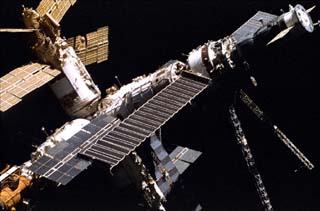 Mir space station taken by the crew of the STS-86 orbiter Atlantis including Spektr, Base Block and Kvant and Progress, Docking Module and Kristall.